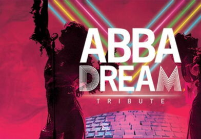 Locandina dello spettacolo ABBADREAM - Tributo agli ABBA al Teatro Repower di Milano con luci colorate e atmosfera anni '70